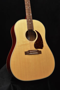 natural acoustic-electric guitar front view with tortoiseshell pickguard and soundhole