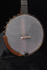 Open-back banjo front view with gray drumhead, metal hooks, and brown wooden rim