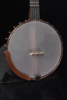 open-back banjo front view with gray drumhead, metal hooks, and brown wooden rim