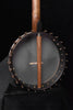 Walnut neck across gray banjo drumhead with chrome rim hooks