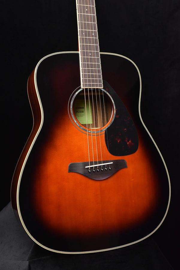 FG830 TBS sunburst acoustic guitar, close front view of body, sound hole, and pickguard
