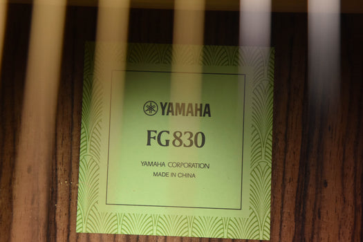 fg830 guitar label plate on wood body, with brand text
