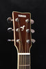Acoustic guitar headstock with tuning pegs and Yamaha logo visible