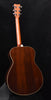 Acoustic guitar back with dark wood grain and cream binding line