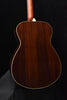 Acoustic guitar back panel with cream edge binding and curved body shape
