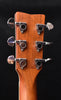 Acoustic guitar headstock close-up, tuning pegs and chrome tuning hardware