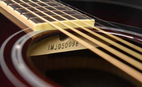 fs830 serial number imj0500098 on guitar neck near the strings