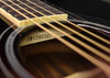 FG830 acoustic guitar fretboard close-up with strings and stamped serial marking