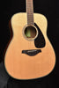 FG830 Natural acoustic guitar, close-up front view with rosette and bridge area