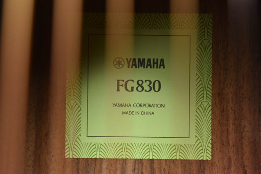 fg830 label on guitar body, shows yamaha and “fg830” text