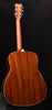 FG830 Natural acoustic guitar back view with dark wood grain and cream binding
