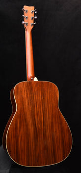 fg830 natural acoustic guitar back view with dark wood grain and cream binding