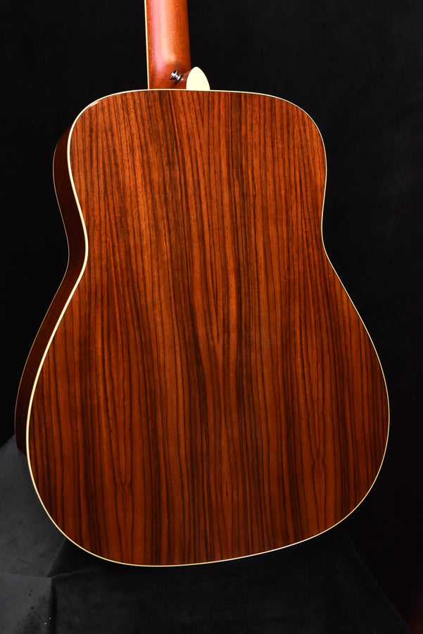 FG830 Natural acoustic guitar back view, detailed wood grain pattern and binding edge