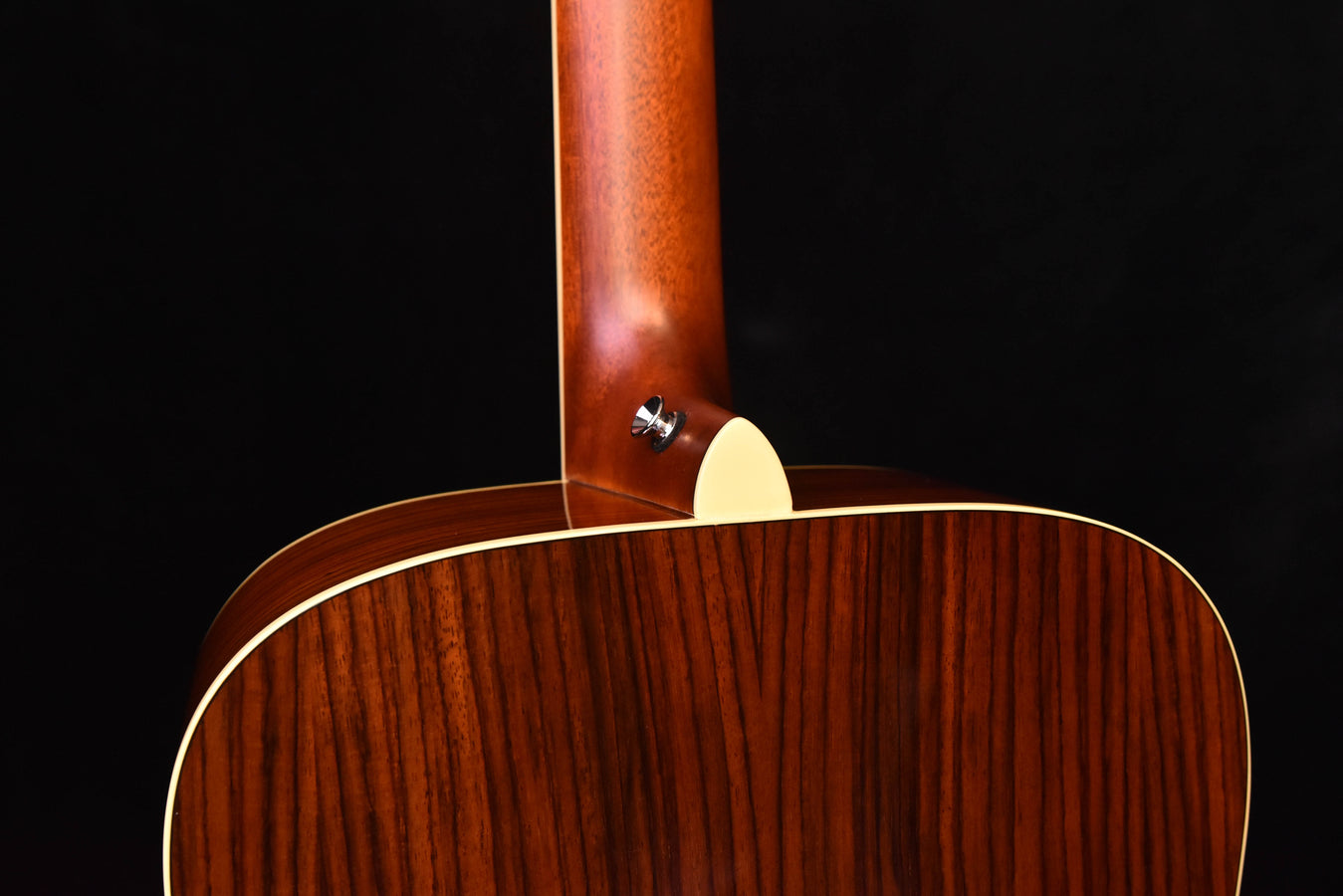 FG830 Natural acoustic guitar back view, lower bout and side neck joint