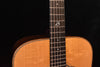 Acoustic guitar neck and fretboard with dot inlays and decorative headstock logo