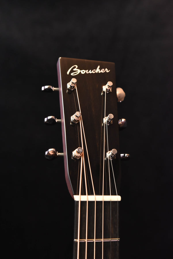 Boucher acoustic guitar headstock with six tuning pegs and engraved logo