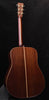 Acoustic guitar body side view with dark wood back and rosewood-style center strip
