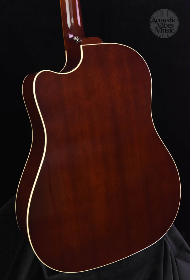 Close view of mahogany acoustic guitar back with curved shape and binding