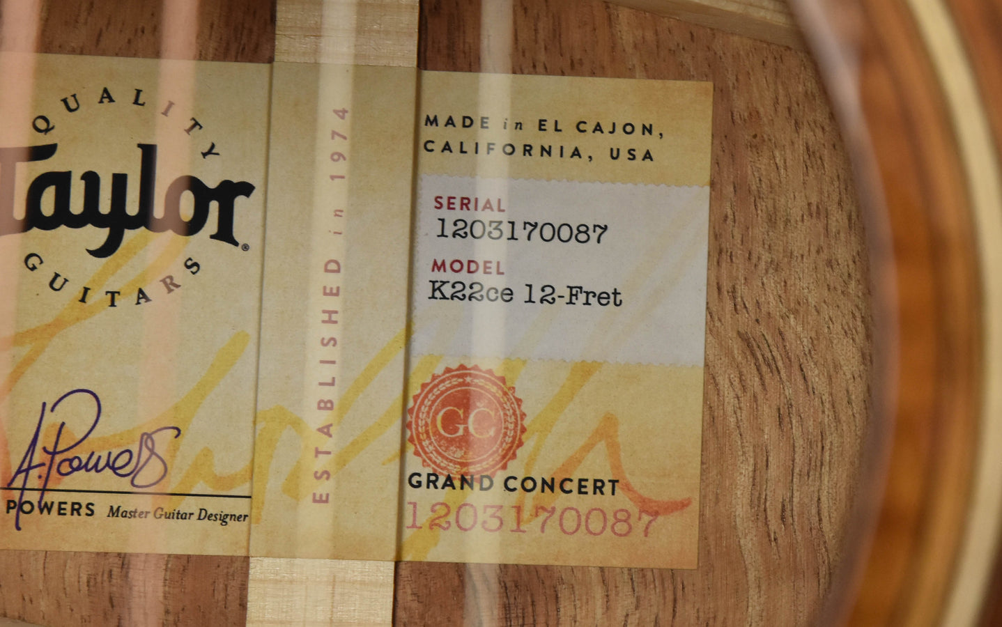 Taylor Koa guitar neck label showing model K22ce 12-Fret and serial number