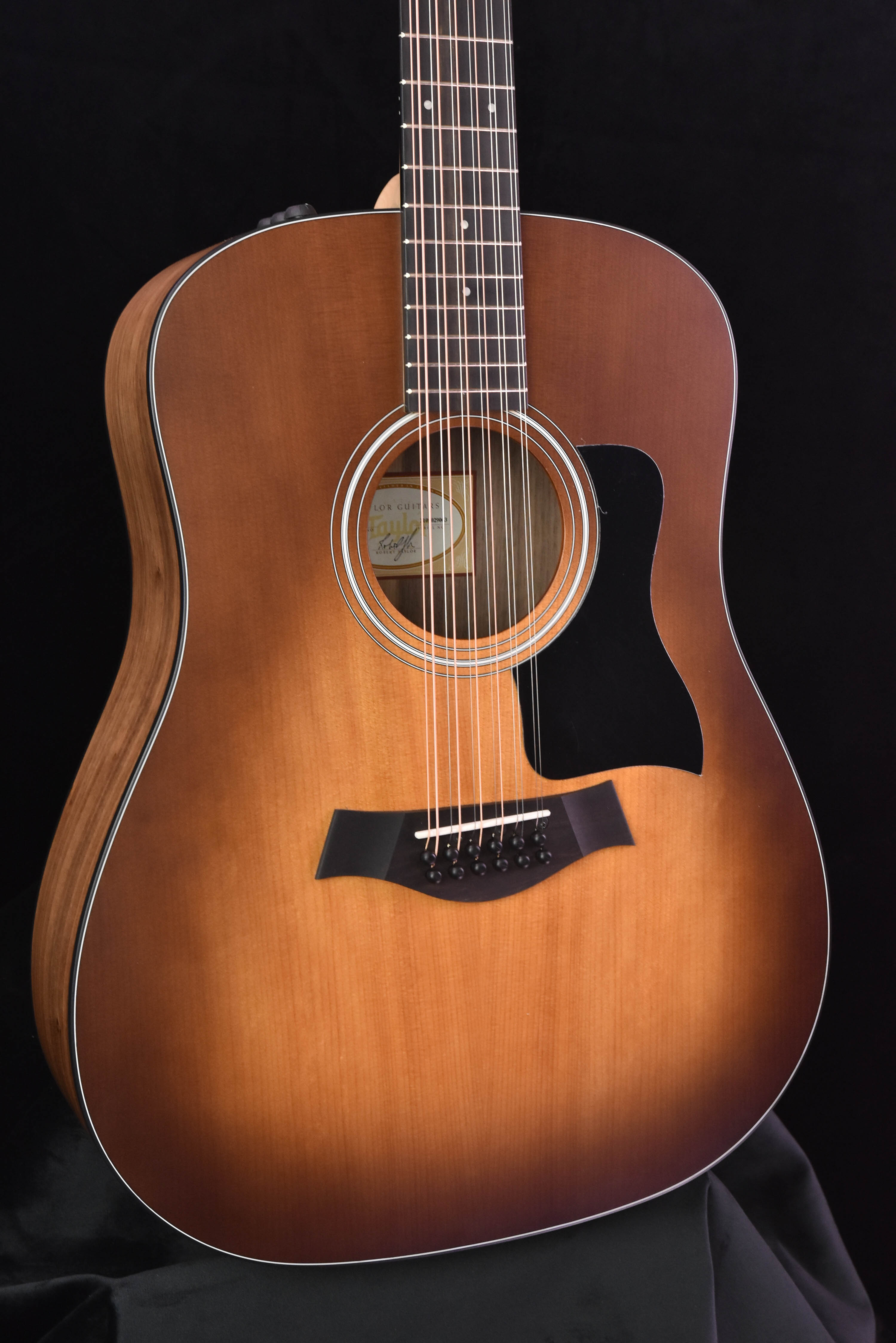 Taylor 150E Sunburst Prototype Walnut/Spruce top.