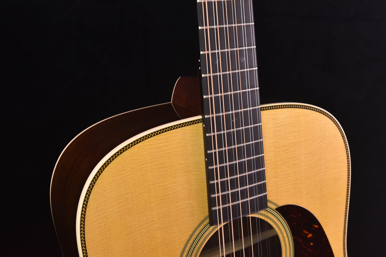 Acoustic guitar upper bout and neck with fretboard and strings