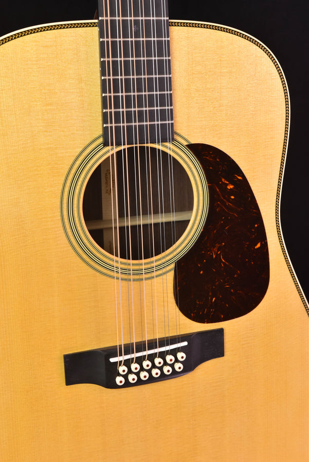Close-up: soundhole rosette and Fishman Matrix Infinity pickup on acoustic guitar