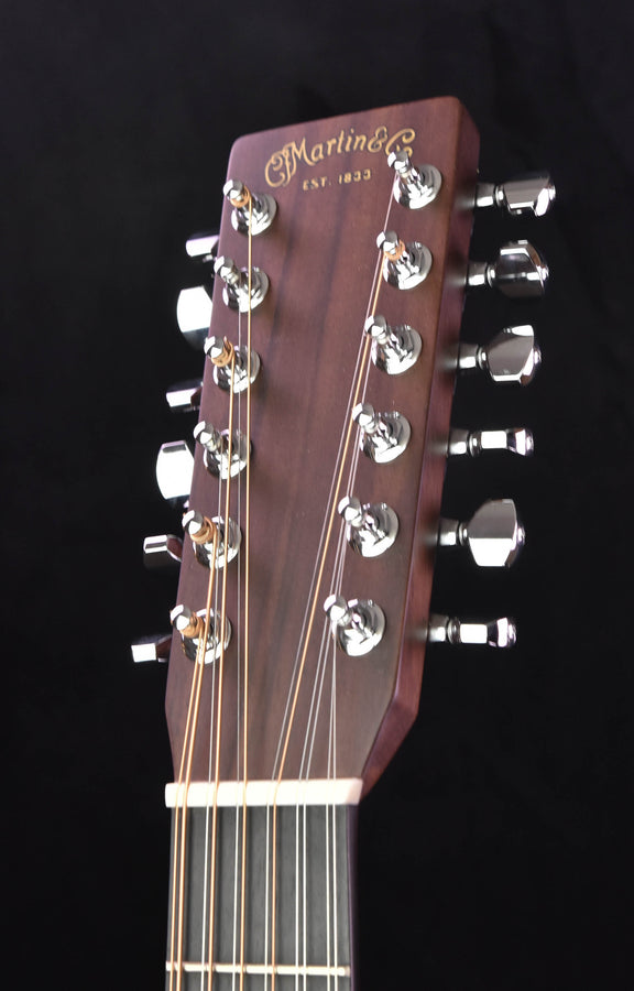 Martin acoustic guitar headstock with tuning pegs and logo