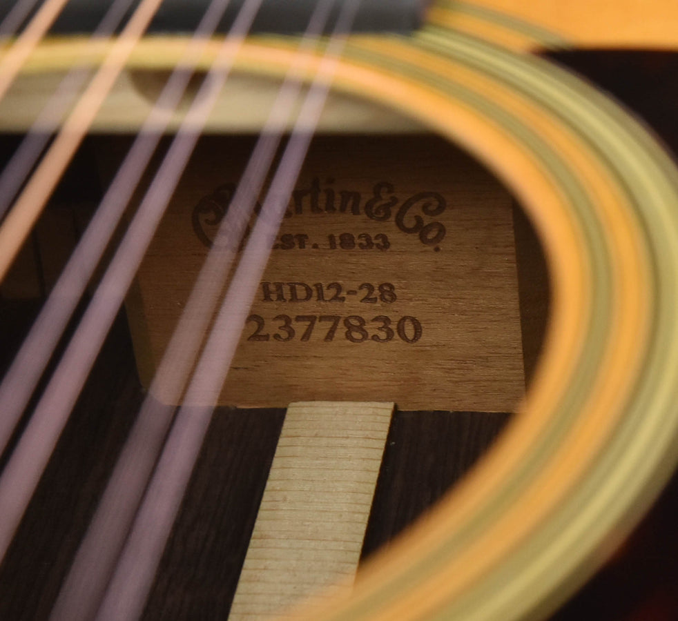 Guitar label with Martin text, model HD12-28, and serial number