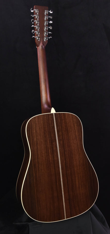 Back view of acoustic guitar with dark wood finish and center seam