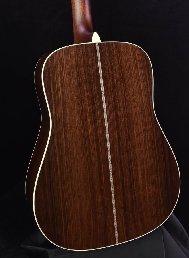 Acoustic guitar top with dark wood grain and cream binding edge