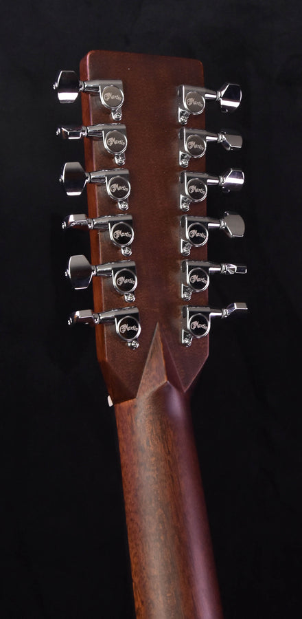 Headstock with chrome tuning pegs and engraved head plate