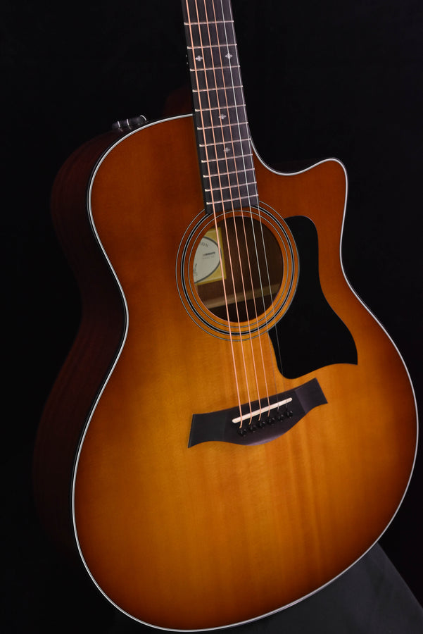 Taylor 316CE sunburst acoustic guitar close-up of body, soundhole and pickguard