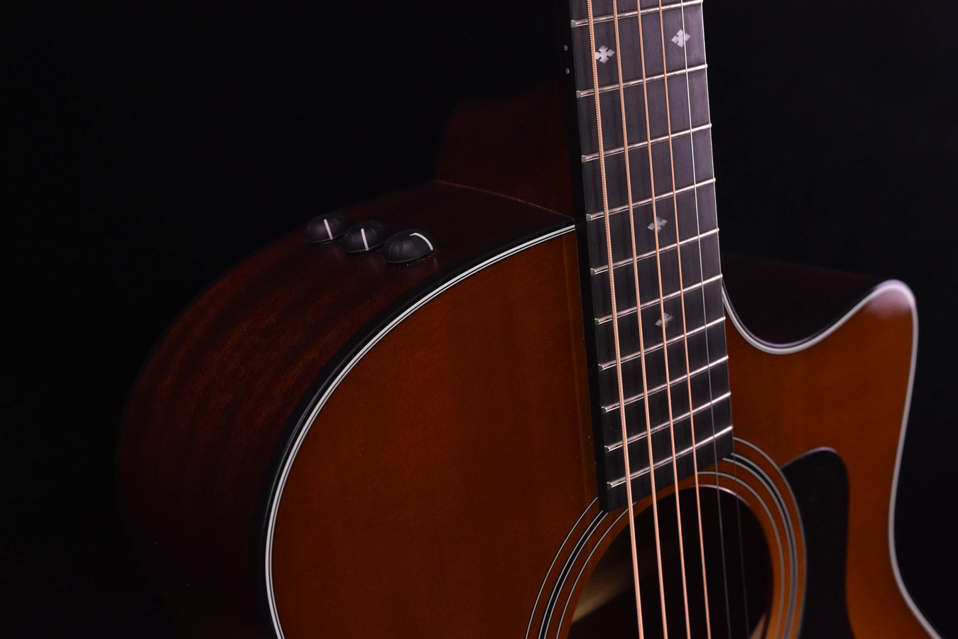 Used Taylor 316CE sunburst acoustic guitar side close-up near neck and fretboard