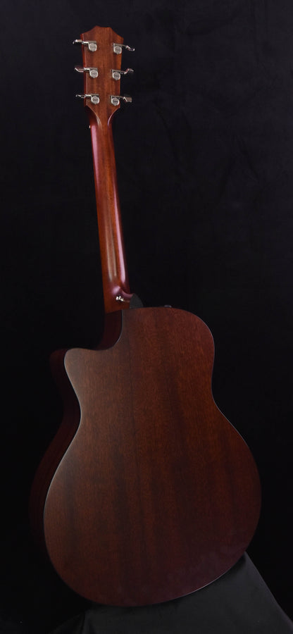 Used acoustic guitar rear view, sunburst finish with neck and headstock visible