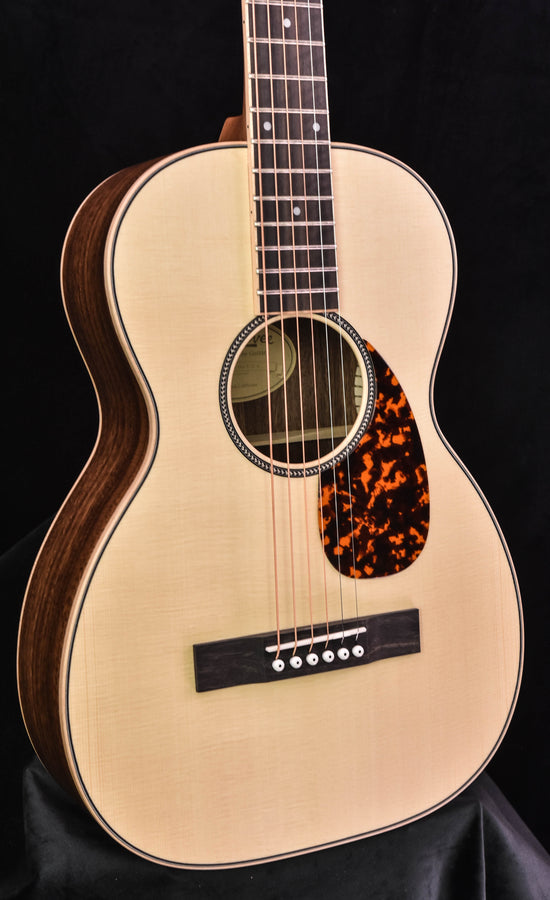 Acoustic parlor guitar, pale top with decorative rosette and orange-black teardrop pickguard