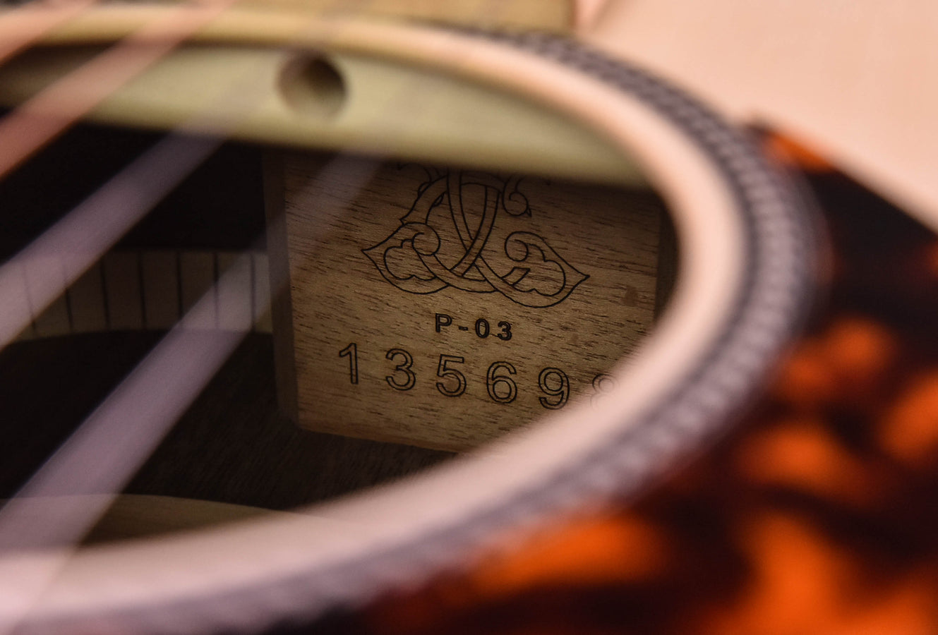 Headstock back stamp showing “P-03” and serial number “43569”