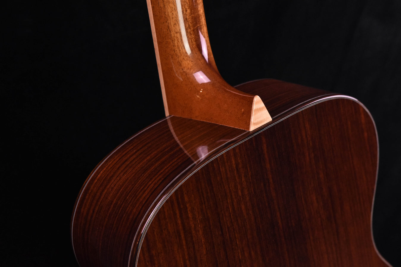 Acoustic guitar upper bout and neck joint, dark wood body with binding