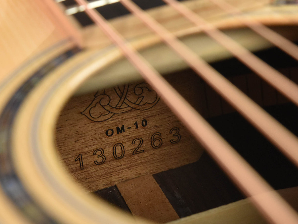 Used OM-10 guitar stamp with OM-10 and serial number 130268