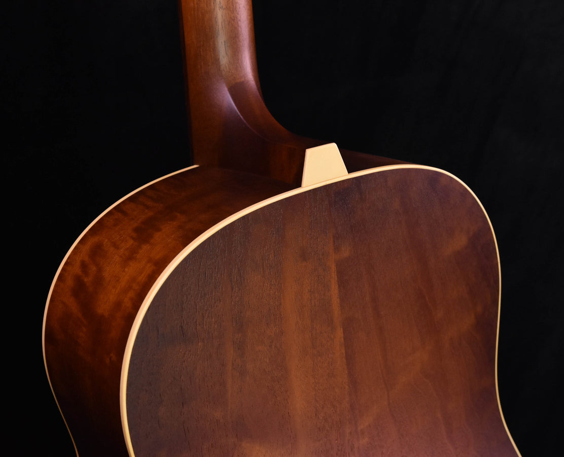 Iris guitar body close-up with cream binding and pickguard