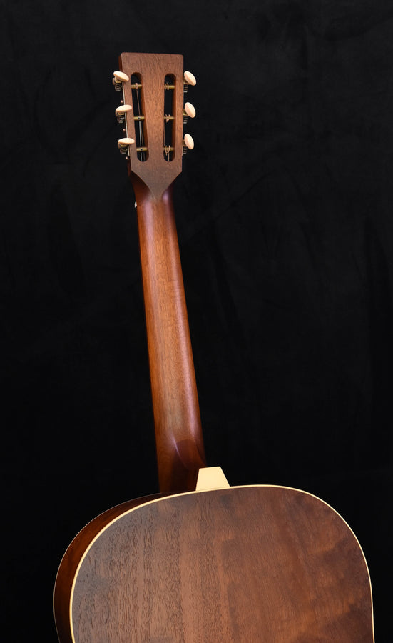 Guitar headstock with slotted peghead and cream tuner buttons