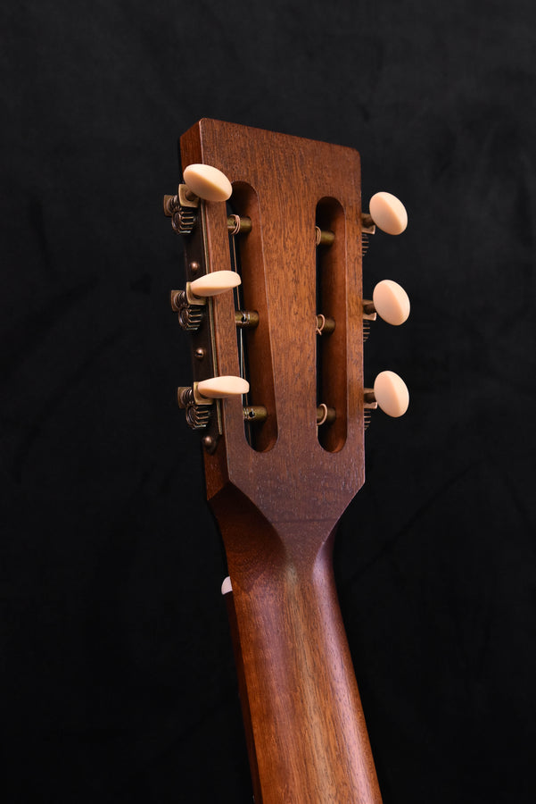 Slotted peghead with tuners on dark stained neck
