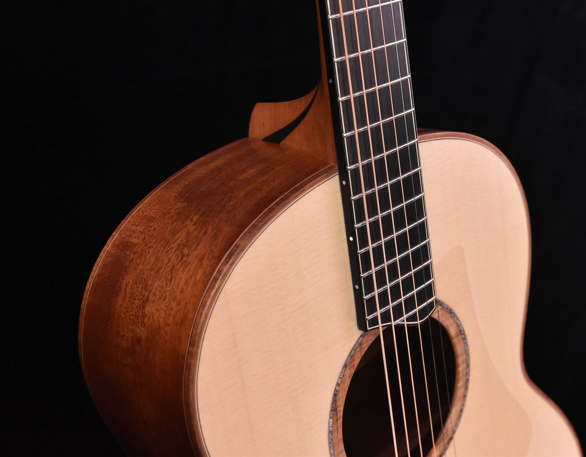 Lowden F50 close-up of guitar body edge and soundhole with fretboard strings visible