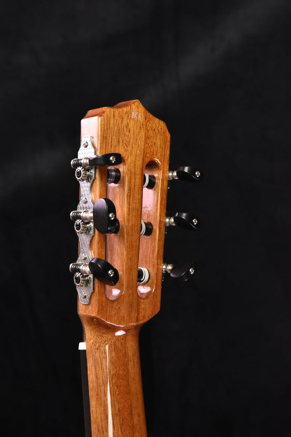 Headstock of Cordoba Fusion cutaway nylon guitar with 12 tuning pegs