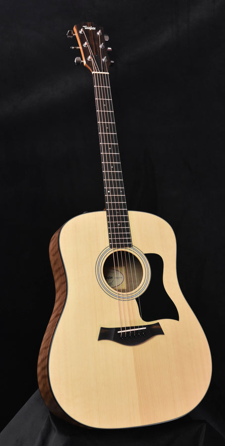 Taylor 110E acoustic guitar in natural light wood with black pickguard