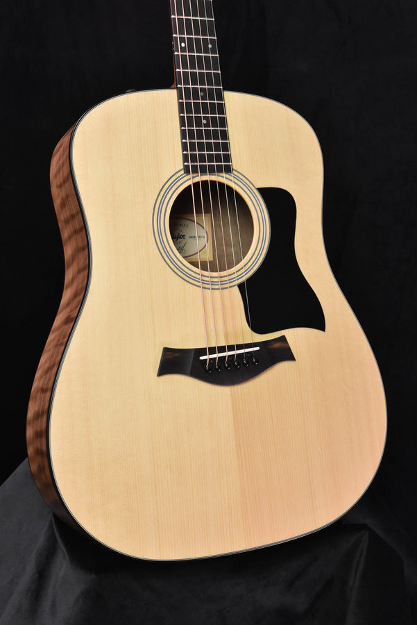 Natural acoustic guitar body with sound hole and black pickguard