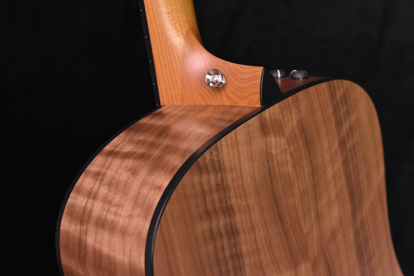 110E guitar body with warm wood grain and black edge binding