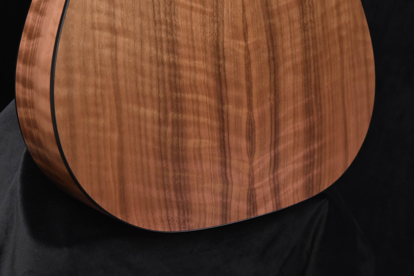 110E soundboard close-up with warm wood grain and smooth finish