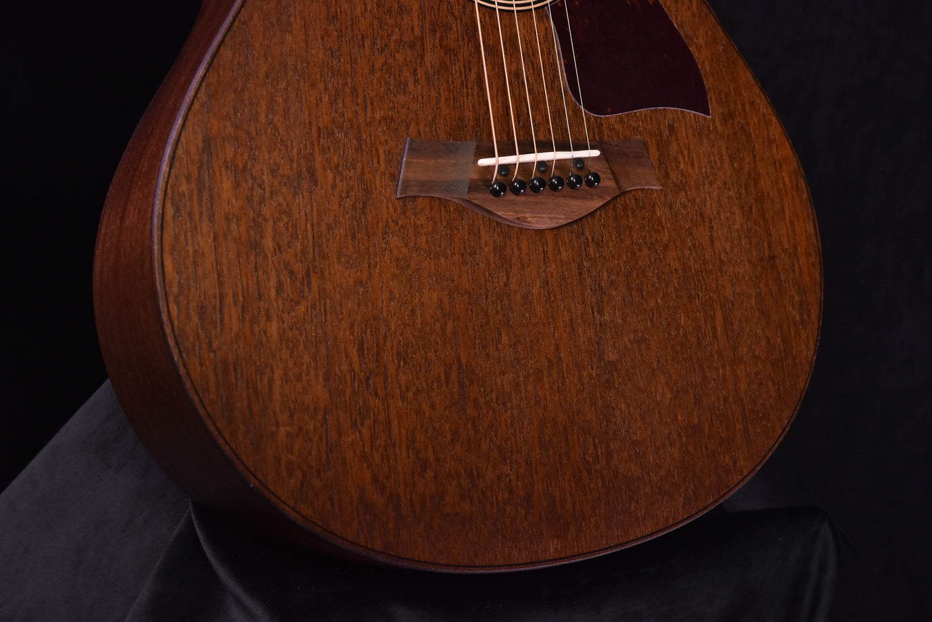 Mahogany grand theater acoustic guitar, detailed body with bridge and strings