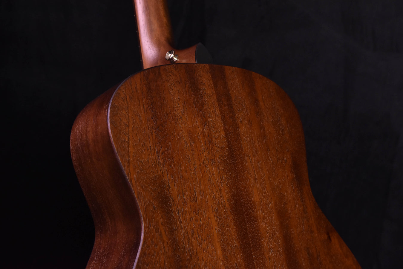 Mahogany grand theater acoustic guitar, back upper bout and neck joint