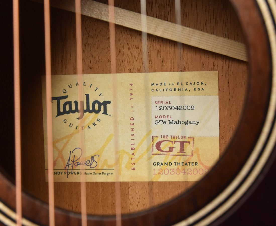 Interior guitar label: Taylor GTe Mahogany, serial and model text